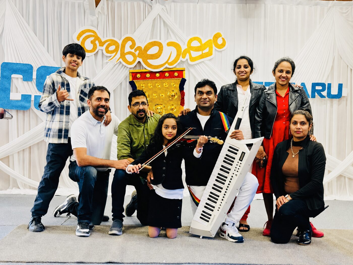 Students performing together with violin and keyboard